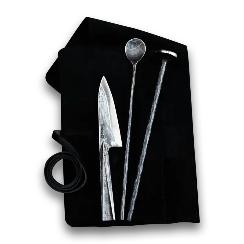 High-quality forged BBQ grilling tools with knife, spoon, and tongs for outdoor cooking.